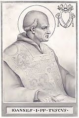 Jan I (ur. w V wieku w Toskanii, zm. 18 maja 526 w Rawennie[1]) – męczennik i święty Kościoła katolickiego, 53. papież w okresie od 13 sierpnia 523 do 18 maja 526[2].


Spis treści
1	Życiorys
2	Zobacz też
3	Przypisy
4	Bibliografia
Życiorys
Jan urodził się w Toskanii, żył na przełomie V i VI wieku. Stolicę Piotrową objął 13 sierpnia 523 r. po swoim poprzedniku, Hormizdasie. W chwili wyboru był człowiekiem schorowanym i w podeszłym wieku[1]. Wprowadził do kalendarza aleksandryjski system obliczania daty Wielkanocy, według obliczeń Dionizego Małego, mnicha pochodzącego ze Scytii Mniejszej[1].

W związku z dekretem cesarza Justyna I, nakazującym arianom zwrot wszystkich kościołów katolikom, król Ostrogotów Teodoryk Wielki, przymusił papieża, aby udał się do Konstantynopola w celu uzyskania złagodzenia zarządzenia oraz zgody na powrót do arianizmu przechrzczonych na katolicyzm arian[2]. Była to pierwsza w historii podróż papieża do Konstantynopola. Jan został przyjęty na dworze cesarskim z honorami[1]. Mieszkańcy miasta wyszli przed mury miasta z płonącymi pochodniami z cesarzem na czele, który złożył pokłon. 19 kwietnia 526 odprawił mszę po łacinie, podczas której włożył na głowę cesarza koronę – fakt ten nie miał jednak znaczenia powtórnej koronacji, a był raczej powtórzeniem gestu patriarchów praktykowanego podczas różnych uroczystości[3]. Jan uzyskał zgodę na zaprzestanie prześladowań arian, lecz nie wspomniał o drugim żądaniu Teodoryka[1]. Po powrocie do stolicy Ostrogotów, Rawenny, Jan I przedłożył utrzymanie edyktu cesarskiego. Ze względu na brak zgody na rekonwersję arian został przez króla uwięziony[4]. 18 maja 526 r. zmarł w więzieniu z powodu złego traktowania. Dla zatuszowania zbrodni Teodoryk zezwolił na uroczysty pogrzeb z udziałem licznego duchowieństwa i wiernych. Według relacji ówczesnego biskupa Rawenny, Maksyma, w czasie pogrzebu miał zostać uwolniony od szatana pewien opętany. Cztery lata później ciało papieża przeniesiono do Rzymu i pochowano w przedsionku Bazylice św. Piotra na Watykanie z napisem: Biskup Pana, Ofiara Chrystusa[1].

Wspomnienie liturgiczne świętego papieża obchodzone jest w Kościele katolickim 18 maja[1].

W ikonografii św. Jan I przedstawiany jest w stroju papieża. Jego atrybutem jest więzienie.

Przyjacielem papieża był słynny filozof Boecjusz[1].